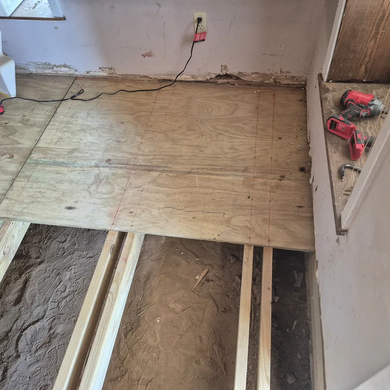 Subfloor framing and plywood decking mid-installation