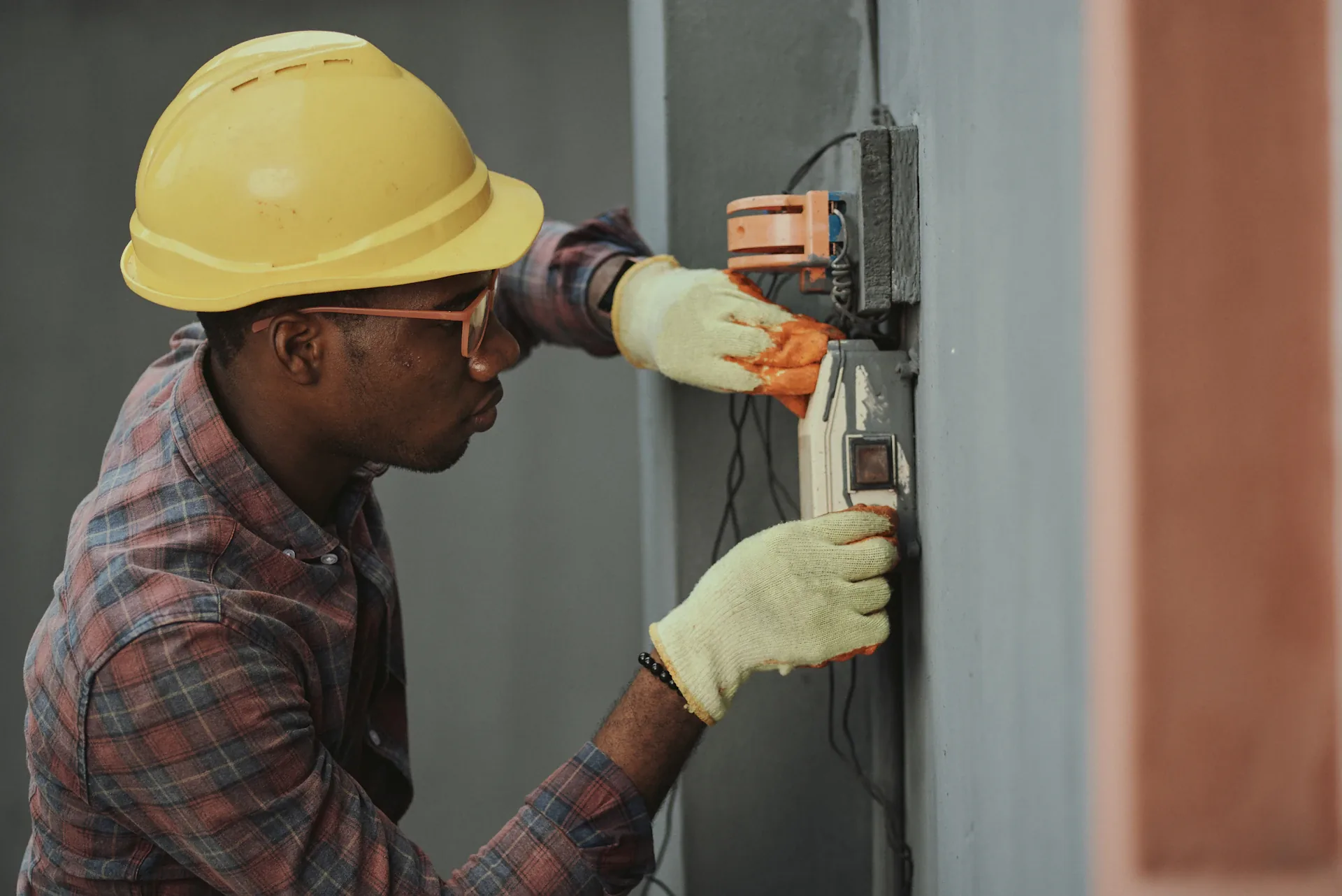 HVAC technician servicing an electrical disconnect box